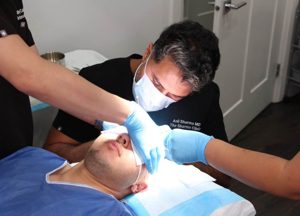 Kaleb-Dahlgren-and-Doctor-Sharma-in-surgery